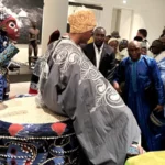 African King Visiting European Museum Sits on Throne Taken From Ancestor